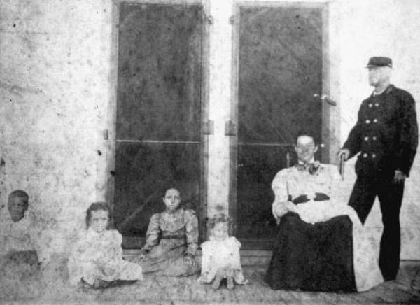 People on porch of Saint George Island home.