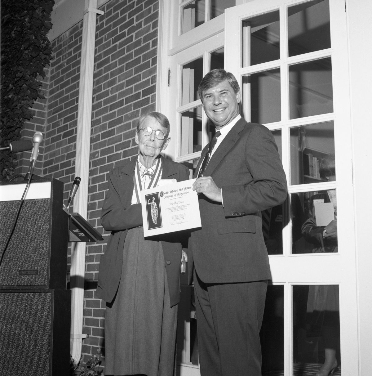Governor Bob Graham presenting certificate to Dorothy Dodd