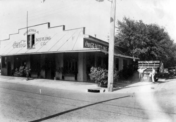 Coca-Cola Bottling Company building, truck, and workers - Wauchula, Florida