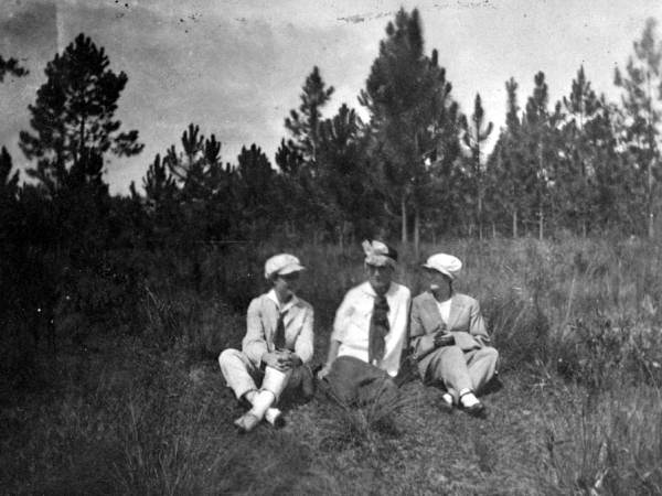 Earl Warren with two young women as the three are cross-dressed