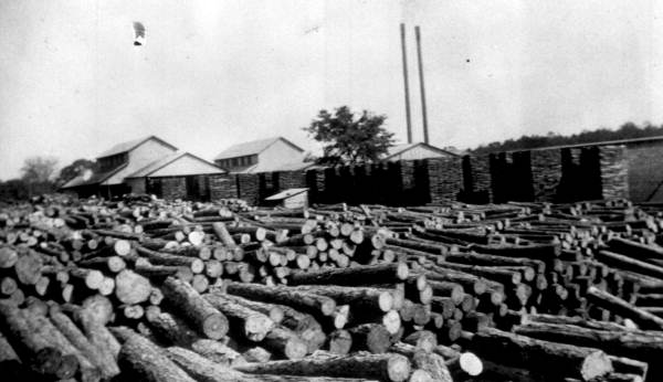 Rows of stacked timber at the Bonifay Heading Company