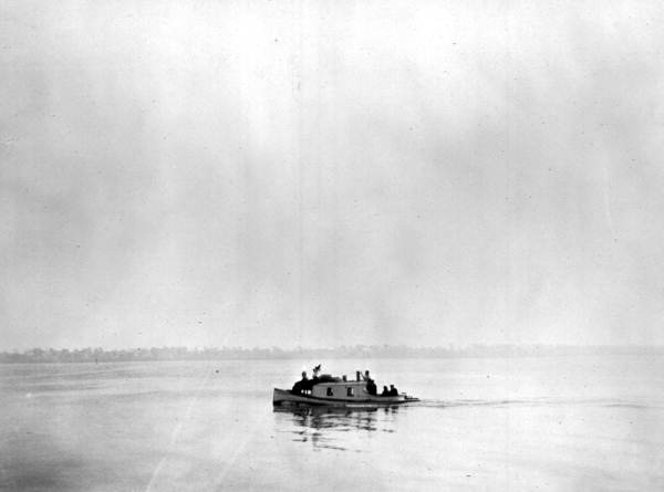 Small boat of tourists on the Indian River