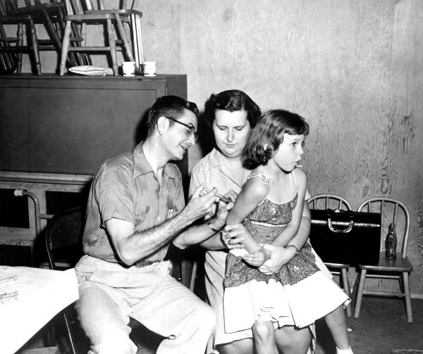 Young girl receiving vaccination shot - Green Cove Springs, Florida.