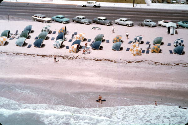 Colorful cabanas and swimmers on Miami Beach- Miami Beach, Florida