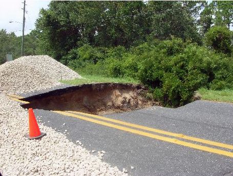Sink hole in Alligator Road after Hurricane Dennis - Alligator Point, Florida.
