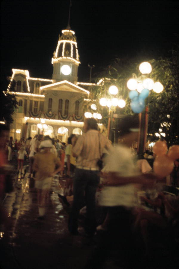 Tourists on Main Street USA at night - Orlando, Florida .