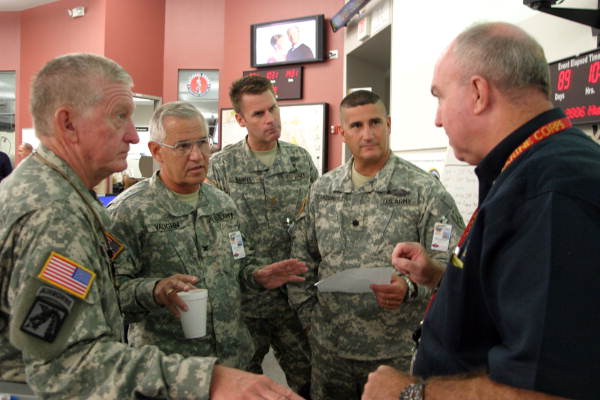 Florida National Guardsmen receiving instructions from Florida Division of Emergency Management Chief of Operations Leo Lachat during Tropical Storm Ernesto