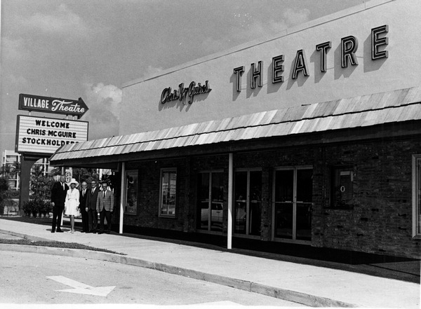 Stockholders standing in front of Chris McGuire's Theatre - Fort Lauderdale, Florida.