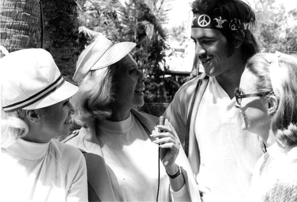 Dinah Shore with friends interviewing an unidentified man - Fort Lauderdale, Florida