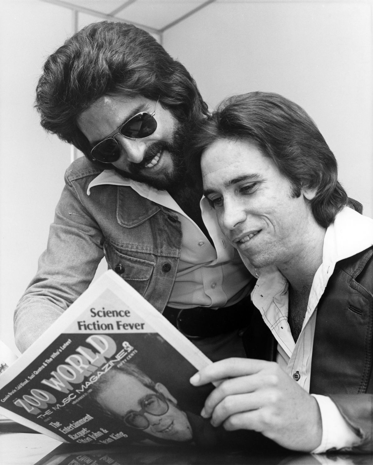 Kenny Loggins and Jim Messina of the Loggins and Messina rock-pop duo reading Zoo World music magazine - Fort Lauderdale, Florida.