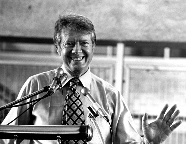 Presidential candidate Jimmy Carter smiling and waving to audience during his speech at Miami-Dade Community College North Campus
