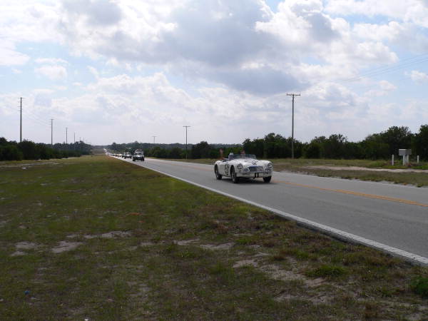 Vintage MG race cars driving from Sebring Raceway to Sebring for "Taste of the Race" event..