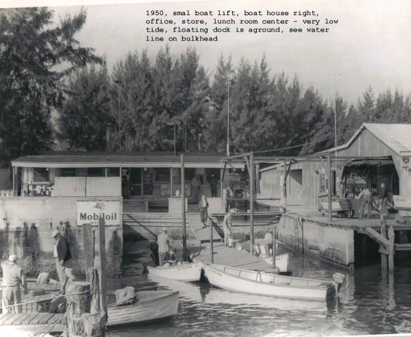 View of small boat rental dock, with lift and boat house to the right, at Layton's Park - Riviera Beach, Florida.
