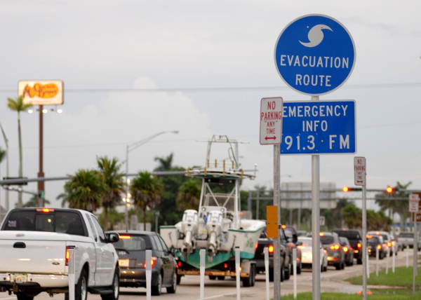A line of vehicles departing the Florida Keys in advance of Tropical Storm Fay enters the Florida peninsula on U.S. 1 in Florida City.