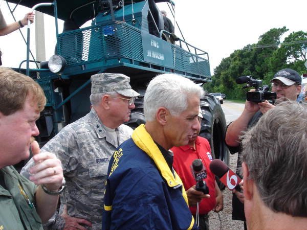Florida Governor Charlie Crist and the Adjutant General of the Florida National Guard Maj. Gen. Douglas Burnett speak with the press near a flooded area of Melbourne, Fla.