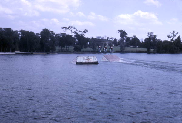 View showing water skiers using jump during a performance at the Cypress Gardens theme park in Winter Haven, Florida.