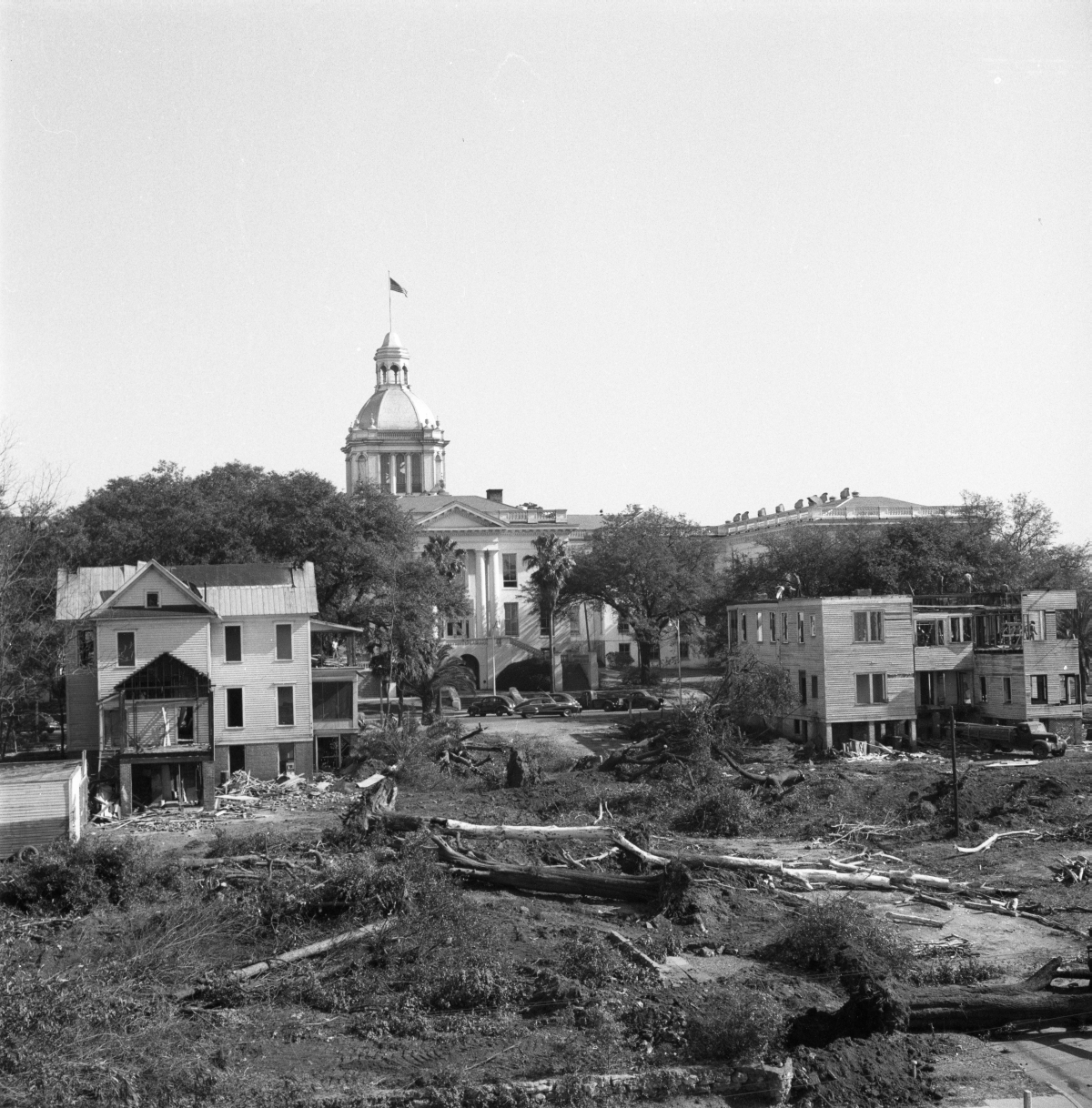 Two views of the demolition of homes surrounding the Capitol