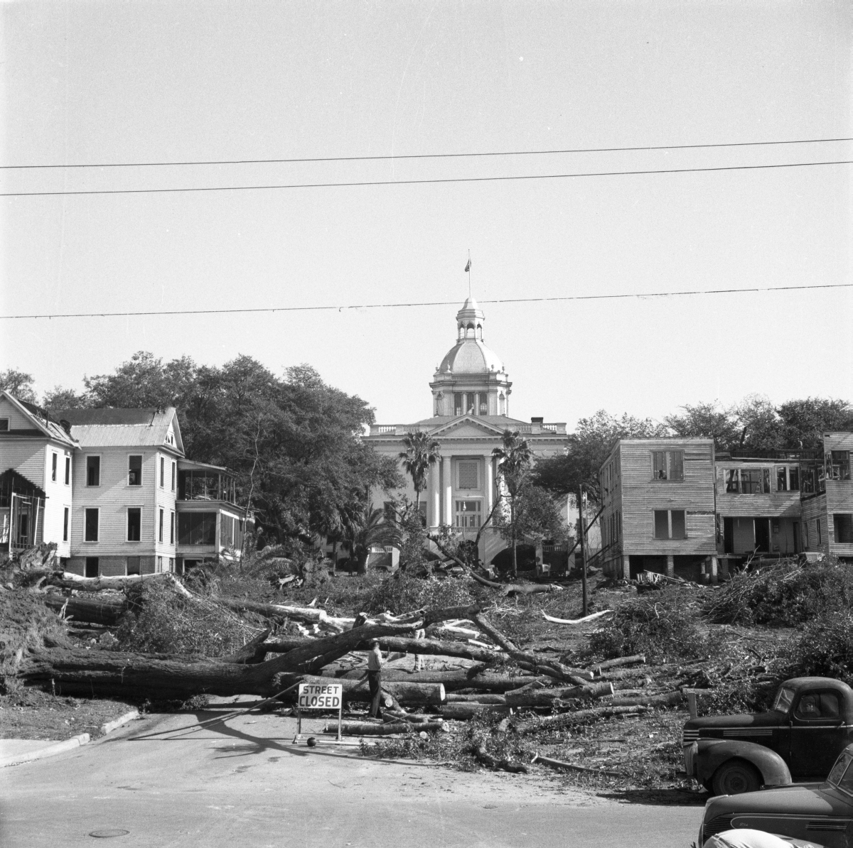 Two views of the demolition of homes surrounding the Capitol
