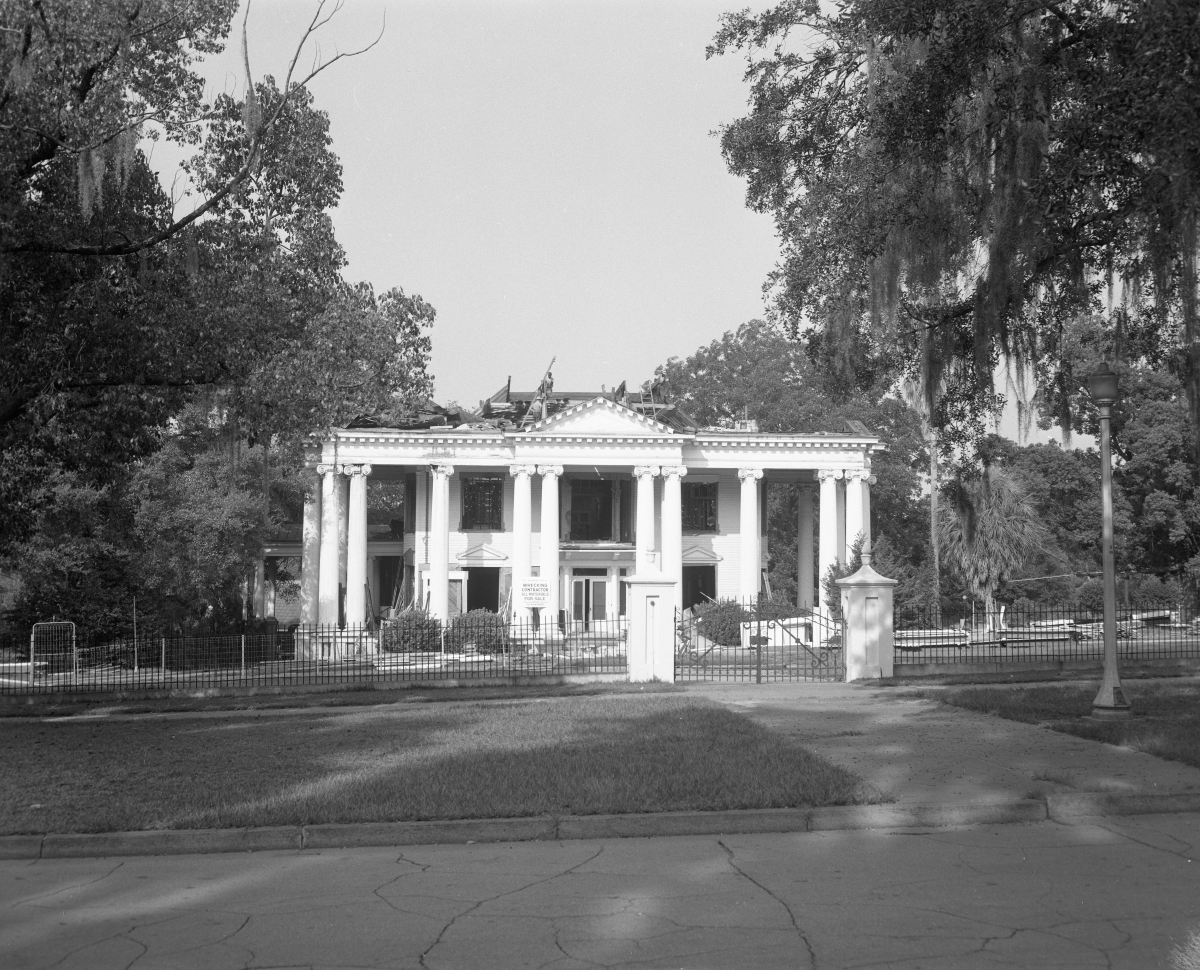 Demolition of the Governor's Mansion with wrought iron gate
