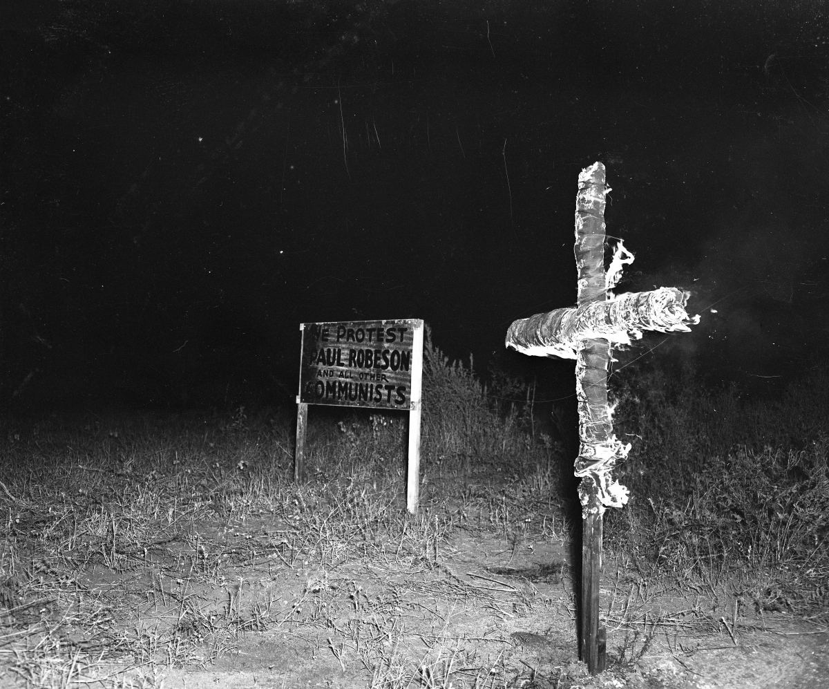 Cross burning by the Ku Klux Klan, in protest of a suspected communist