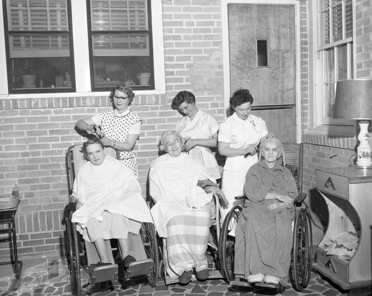 Three hairdressers working.