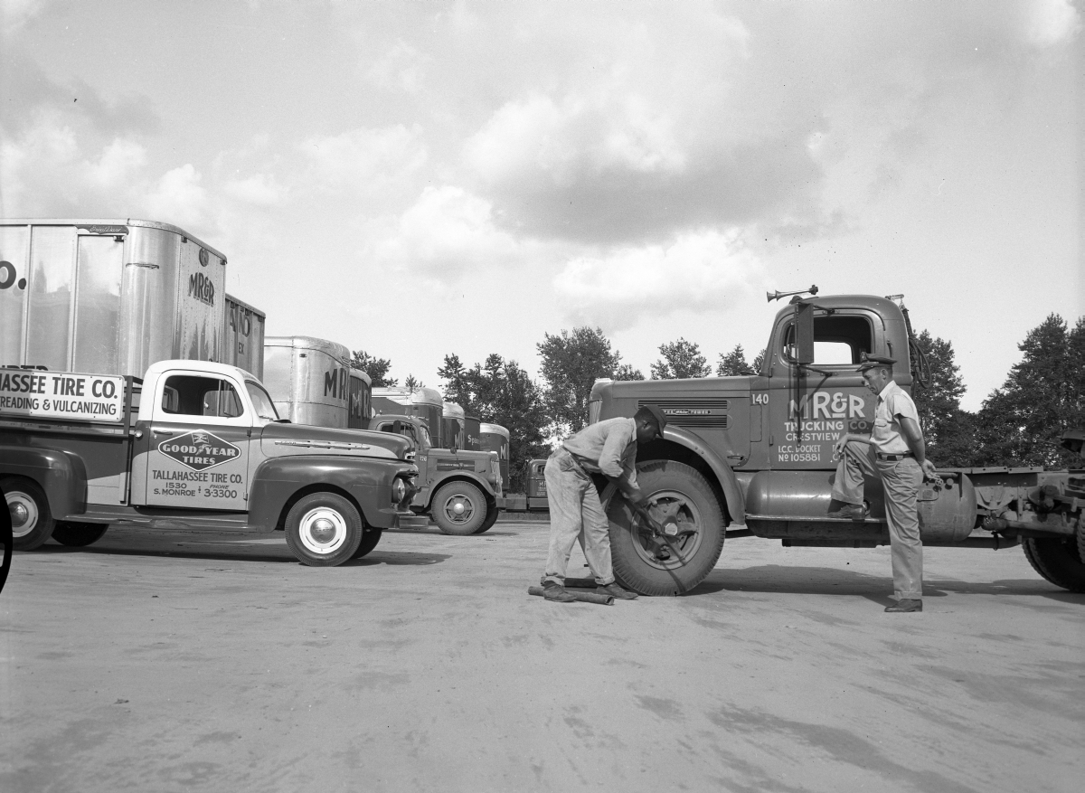 Replacing a tire for M.R. and R. trucking.