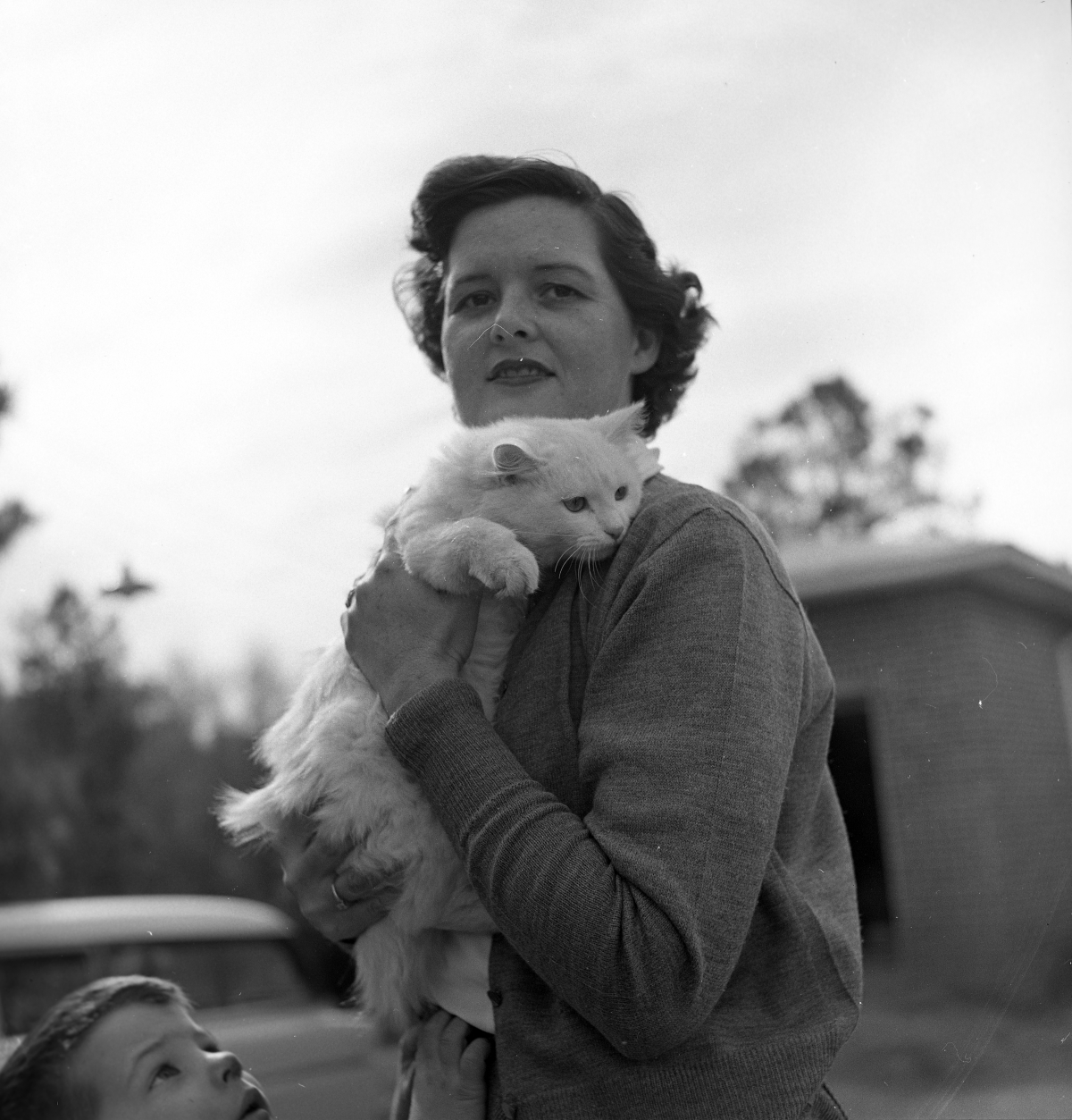Mrs. Gene Davis holding her cat.