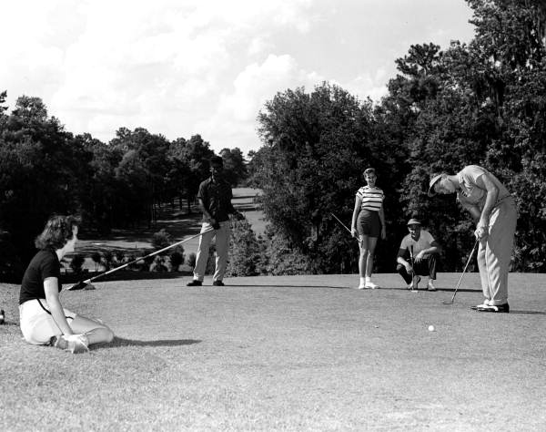 Couples playing golf at a golf course - Tallahassee, Florida.
