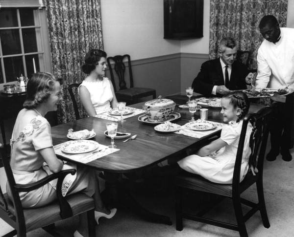 Governor LeRoy Collins and wife dining with two of their daughters.
