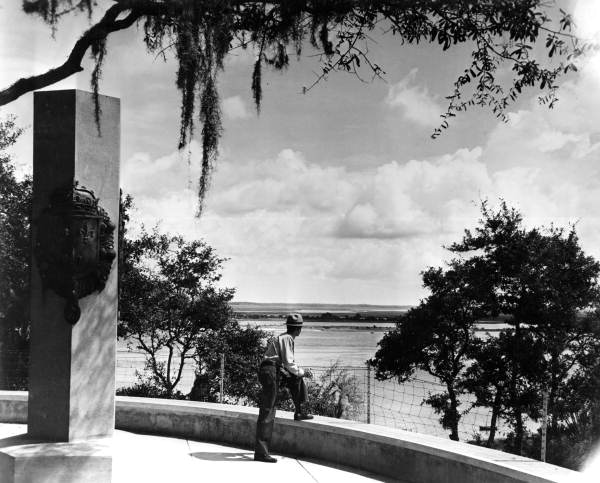A park ranger viewing the St. Johns River from the Ribault Monument at the Fort Caroline National Memorial.