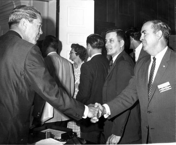 Governor Burns shaking hands with members of Dade County delegation - Tallahassee, Florida.