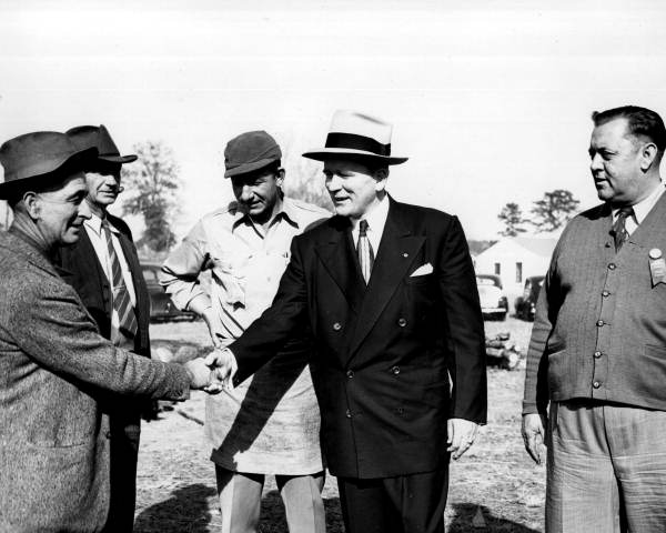 Gubernatorial candidate Fuller Warren greeting farmers