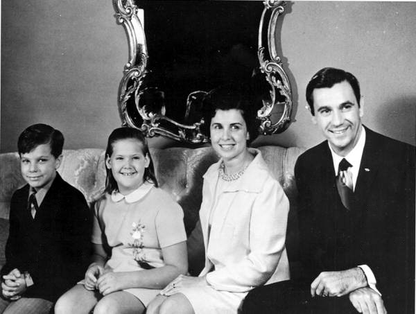 Askew family poses for a photo on sofa - Tallahassee, Florida.