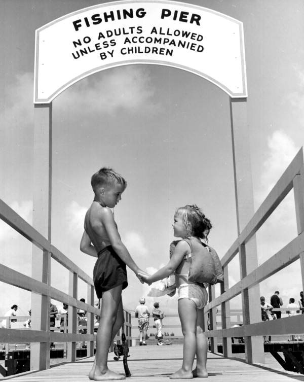Children at the entrance to fishing pier