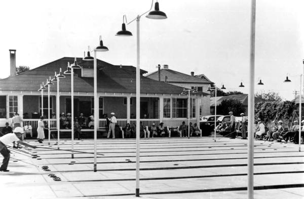 People enjoying a game of shuffleboard
