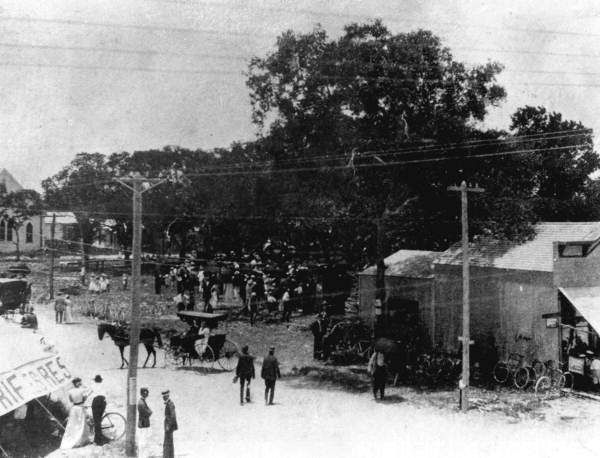 Group of people gathered on East Flagler Street at 1st Avenue - Miami, Florida.