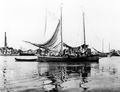 Man and his laundry on oyster boat - Apalachicola, Florida