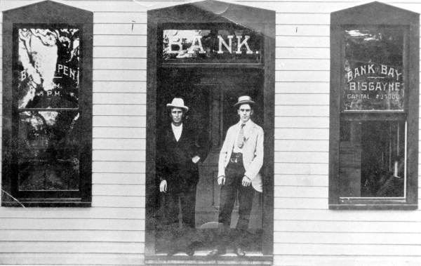 Men standing in the entrance to the Bank of Bay Biscayne - Miami, Florida.