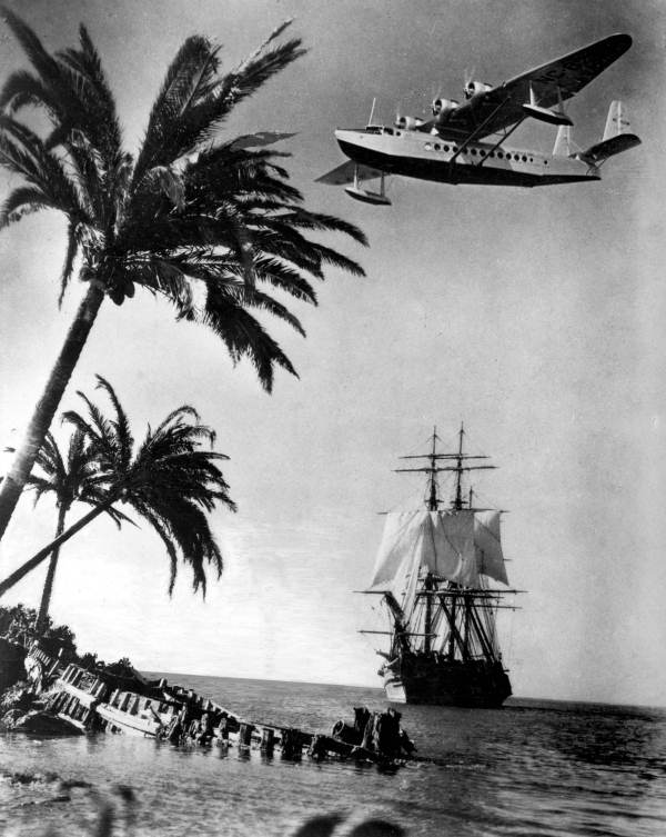 Sikorsky S-42 plane flying over a sailing galleon - Miami, Florida