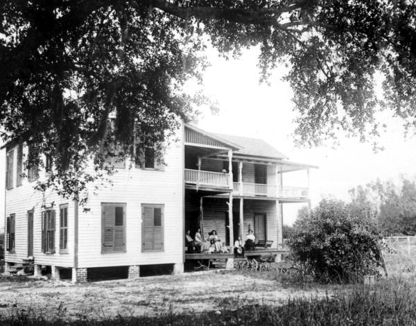 Family sitting on porch of residence - Kissimmee, Florida