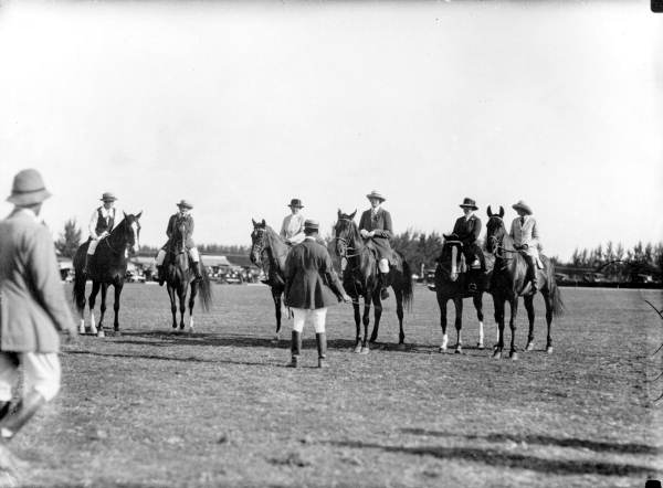 Polo players and their horses on the field - Miami Beach, Florida.