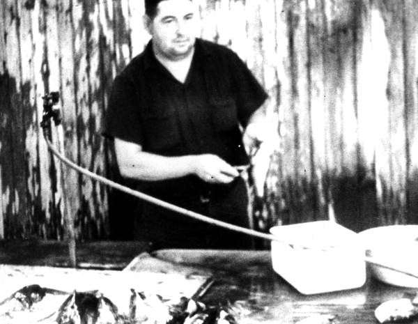 Clarence Loyd preparing fish for a political rally - Lake City, Florida