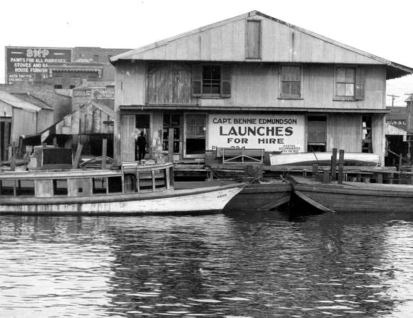 Building advertising launches for hire at the Bayen street dock - Pensacola, Florida.