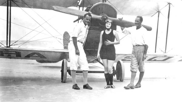 Winter visitors in front of biplane - Atlantic Beach, Florida