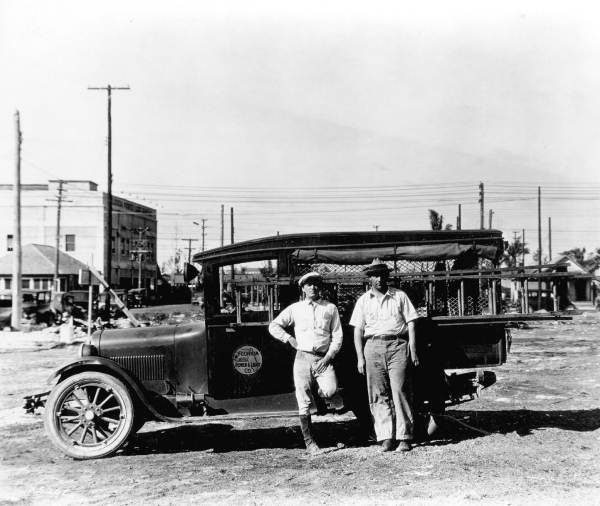 Employees with a truck of the Florida Power and Light Company