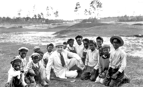 Mr. Hirsch with caddies at the Coral Gables Country Club golf course