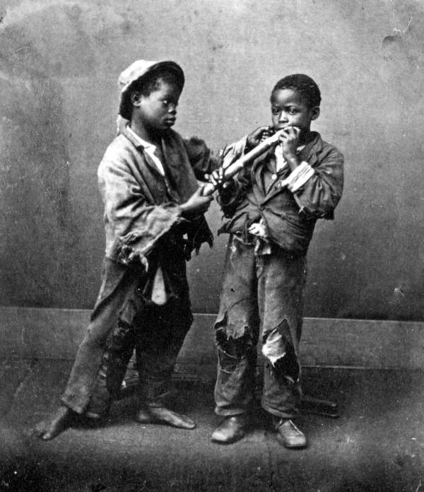 African American boys posed in fake fight over sugar cane