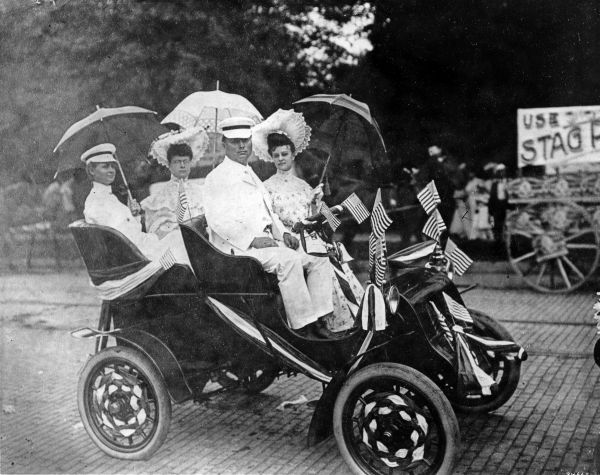 People sitting in a decorated Cadillac - Tampa, Florida.