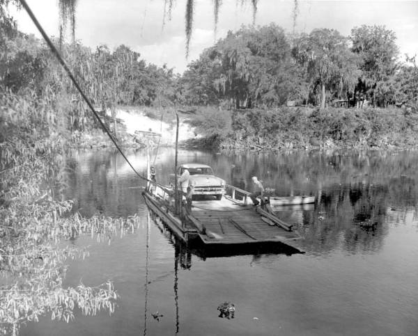 Automobile transported by cable ferry across the Suwannee River - Rock Bluff Landing Gilchrist County, Florida.