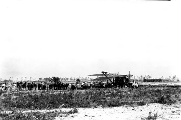 Construction workers building a racetrack for horses - Pompano, Florida.
